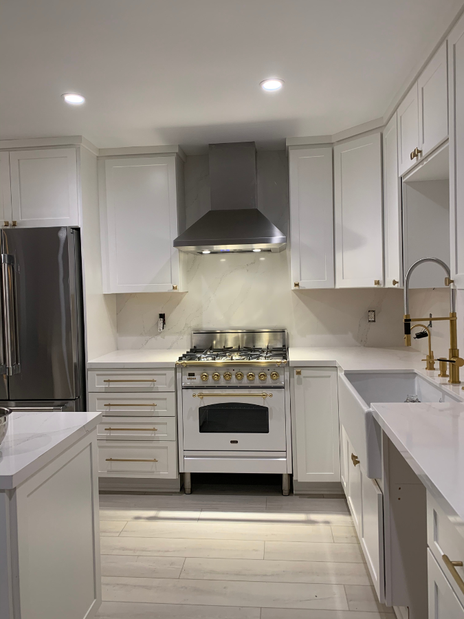 casa-installations-kitchen-gold-white-stove-cabinets